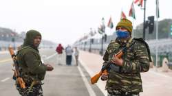 New Delhi: Army personnel stand guard at the Rajpath on the eve of the Republic Day celebrations
?