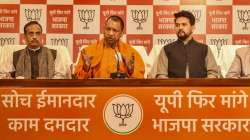 Yogi Adityanath addresses a press conference at the BJP office, in Lucknow. Union Minister Anurag Thakur and UP's Deputy CM Dinesh Sharma are also present.?