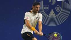 Stefano Travaglia plays a back hand during Tata Open Maharashtra tennis tournament game 