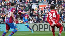 FC Barcelona's Jordi Alba (centre) hits the ball on the volley to score team's equaliser against Atl