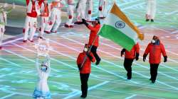 Flag bearer Arif Mohd Khan of Team India leads their team out during the Opening Ceremony.