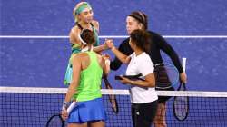 Lydudmyla Kichenok, Jelena Ostapenko shake hands with Lucie Hradecka and Sania Mirza of India 