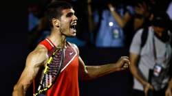 Spain's Carlos Alcaraz celebrates after defeating Argentina's Diego Schwartzman at the ATP Rio Open 