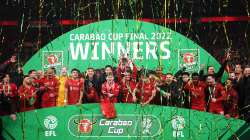 Liverpool's Jordan Henderson lifts the Carabao Cup trophy following victory over Chelsea at Wembley 