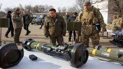 President Volodymyr Zelenskyy inspects weapons during a visit to Ukrainian coast guards in Mariupol, Donetsk region, eastern Ukraine.