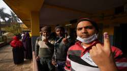 A voter display their index fingers after casting their votes during in Uttar Pradesh.