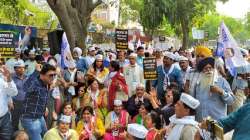 AAP workers protest against BJP over delay in holding MCD civic polls. 