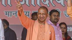 Uttar Pradesh Chief Minister Yogi Adityanath waves at supporters during a public meeting at Sidharth Nagar, in Gorakhpur, Tuesday, March 01, 2022.