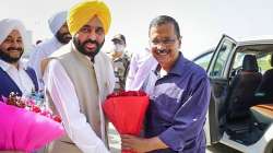 Punjab CM-designate Bhagwant Mann receives AAP national convenor Arvind Kejriwal at Amritsar airport.