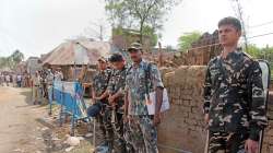 Security personnel stand guard after 8 people died in the violence that broke out at Bogtui village in Birbhum district