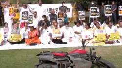 Congress leaders protest against fuel price hike at Vijay Chowk in Delhi