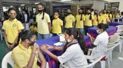 A healthcare worker administers a dose of the Covid-19 preventive vaccine to a student at a vaccination centre, in Rajkot.