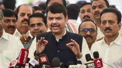 Opposition leader Devendra Fadnavis interacts with the media at the Maharashtra Assembly, on the first day of the budget session, in Mumbai, Thursday, March 3, 2022.