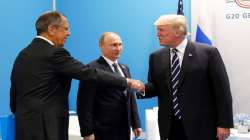 US President Donald Trump, right, greets Russian Foreign Minister Sergey Lavrov, left, prior his talks with Russian President Vladimir Putin, center, during the G20 summit in Hamburg Germany in July 7, 2017.