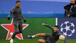 PSG's Kylian Mbappe (left) with teammate Leandro Paredes during a training session at the Santiago B