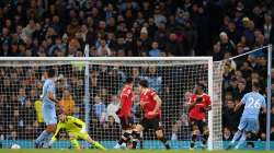 Manchester City's Riyad Mahrez scores the side's third goal against Manchester United during an EPL 