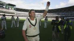 Shane Warne of Australia acknowledges the crowd after his final Test on the MCG after day three of t