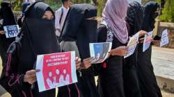 Muslim students wearing burqa protest against the Karnataka HC's verdict on Hijab by boycotting their internal exams in front of IDSG college, in Chikmagalur, Wednesday, March 16, 2022.