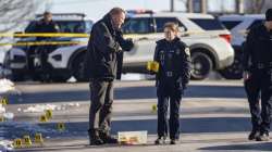 Police investigate a shooting outside East High School in Des Moines, Iowa, Monday, March 7, 2022.