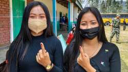 Voters show indelible ink after casting their votes during the Manipur Assembly elections.