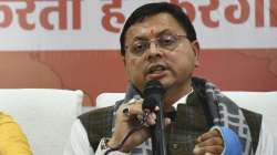 BJP leader Uttarakhand CM-designate Pushkar Singh Dhami speaks during a press conference in Dehradun