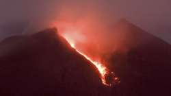 Lava flows down from the crater of Mount Merapi seen from Cangkringan village in Sleman, Yogyakarta