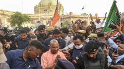 Uttar Pradesh Chief Minister Yogi Aditiyanath arrives for celebrations at the BJP office following their win in Assembly polls, in Lucknow.