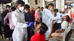 Health workers collect swab samples for Covid-19 testing.