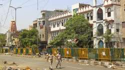 Policemen patrol in the violence-hit Jahangirpuri area, in New Delhi, Saturday, April 23, 2022.