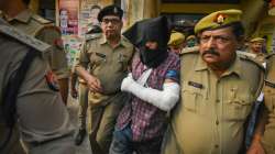 Ahmed Murtaza Abbasi, accused of attacking policemen outside the Gorakhnath temple, being presented in a court by police, in Gorakhpur, Monday, April 4, 2022.