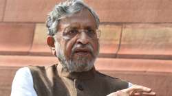 BJP leader Sushil Kumar Modi speaks to media personnel, during the Winter Session of Parliament, in New Delhi, Tuesday, Nov. 30, 2021.