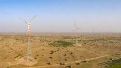 Adani Green switches on India first hybrid power plant, Adani Green news, Adani Green first hybrid p