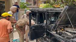 Members of the forensic team and police personnel inspect the vehicle of Punjabi singer and Congress leader Sidhu Moose Wala for further enquiries, in Mansa.