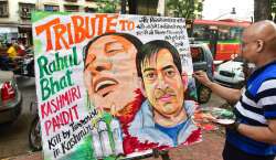 A student from Gurukul art school makes a painting to pay tribute to Rahul Bhat, a Kashmiri pandit killed by militants in Kashmir