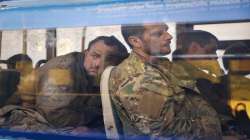 Ukrainian servicemen sit in a bus after they were evacuated from the besieged Mariupol's Azovstal steel plant, near a remand prison in Olyonivka, in territory under the government of the Donetsk People's Republic, eastern Ukraine. 