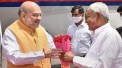 Amit Shah being welcomed by Nitish Kumar on his arrival at Japrakash Narayan Airport, in Patna, Saturday, April 23, 2022.