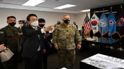 South Korean President-elect Yoon Suk Yeol, second from left, speaks as Gen. Paul LaCamera, right, commander of USFK and the South Korea-U.S. Combined Forces Command, listens during his visit to Camp Humphreys in Pyeongtaek, South Korea.