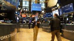 Traders work on the floor at the New York Stock Exchange in New York