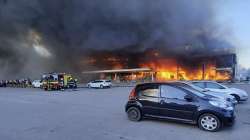 In this image made from video provided by Ukrainian State Emergency Service, firefighters work to extinguish a fire at a shopping center burned after a rocket attack in Kremenchuk, Ukraine, Monday, June 27, 2022. 