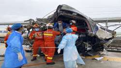 In this photo released by China's Xinhua News Agency, emergency personnel help a passenger off a damaged train car after it derailed in Rongjiang County in southwestern China's Guizhou Province, Saturday, June 4, 2022. 