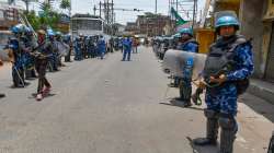 Security personnel stand guard, a day after clashes during protest against now-suspended BJP leaders remark on Prophet Muhammad, in Ranchi, Saturday.