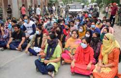 People from the Kashmiri Pandit community shout slogans during their protest march against the killing of the school teacher Rajni Bala, near Srinagar Airport, Tuesday, May 31, 2022. Bala was shot dead by terrorists in Kulgam district of South Kashmir.