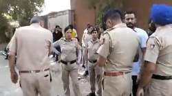 Cops outside the IAS officer's house. 