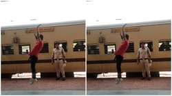 A man performing backflips at the railway station