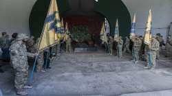 Officers of the Azov regiment pay their last tribute to a serviceman killed in a battle against the Russian troops in a city crematorium in Kyiv, Ukraine.