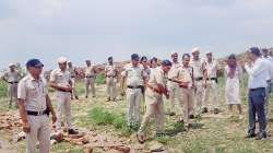 Police personnel at the crime scene after DSP Surender Singh Bishnoi was allegedly mowed down to death by the mining mafia at Pachgaon in Nuh district, Haryana.