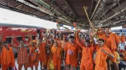 
Patna: Kanwariyas raise slogans on the first day of holy month of ‘Sawan’ during the 'Kanwar Yatra' in Patna on Thursday, July 14, 2022.