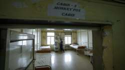 A health worker stands at a monkeypox ward set up at a civil hospital in Ahmedabad, India, Monday, July 25, 2022. 
