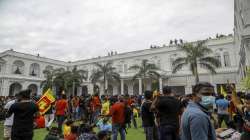 Protesters gather inside the premises of Sri Lankan presidents official residence in Colombo, Sri Lanka, Saturday, July 9, 2022. 