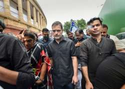 Congress leader Rahul Gandhi, wearing black clothes, along with party MPs marches towards Rashtrapati Bhawan as part of party’s nationwide protest over price rise, unemployment and GST hike on essential items, in New Delhi,